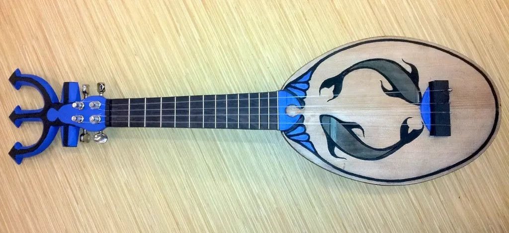 A hand-crafted ukulele, painted with fish